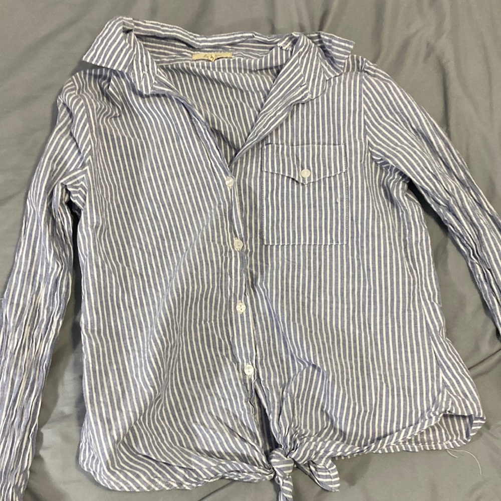 Blue and white striped button down T-shirt with pocket and tie